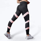 Women's high-waisted yoga leggings, black with pink stripes and dotted mesh shin and calf panels