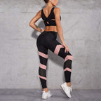 Women's high-waisted yoga leggings, black with pink stripe panels and sock-style mesh cuffs