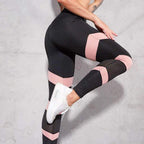 Women's high-waisted yoga leggings, black with pink banded panels and dotted mesh calves
