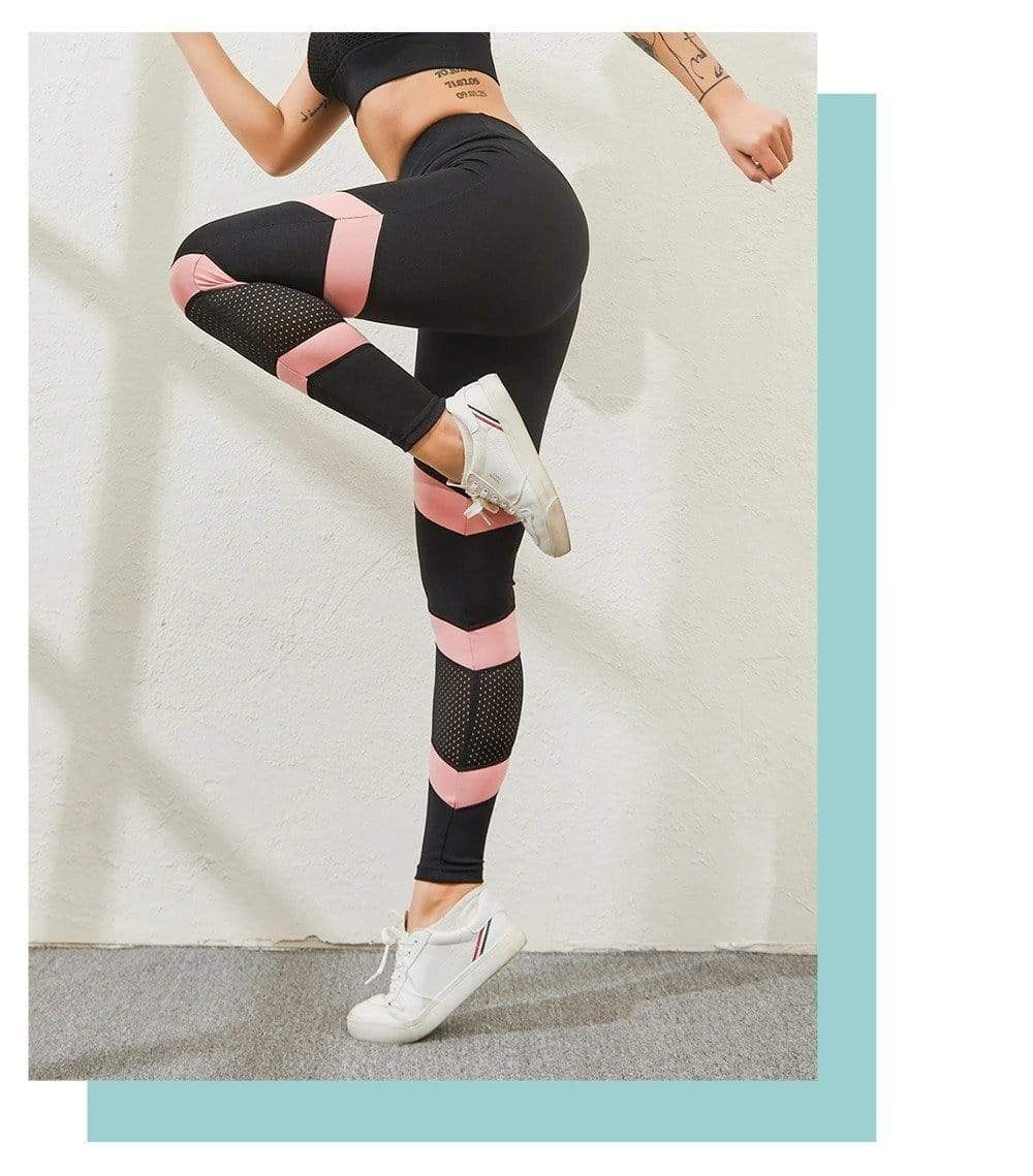 Women's high-waisted yoga leggings, black with pink stripe blocks and dotted mesh panels at calves
