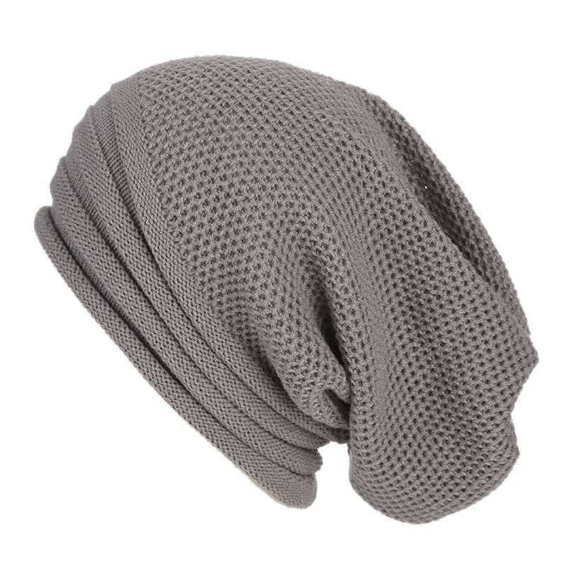 Light gray knitted beanie with ribbed fold-over cuff and textured stitch pattern