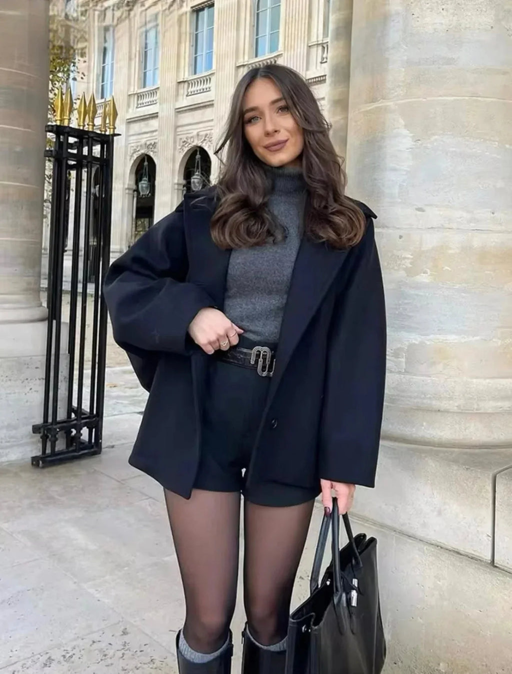 Women's loose-fit dark coat with large lapels and button front, long sleeves