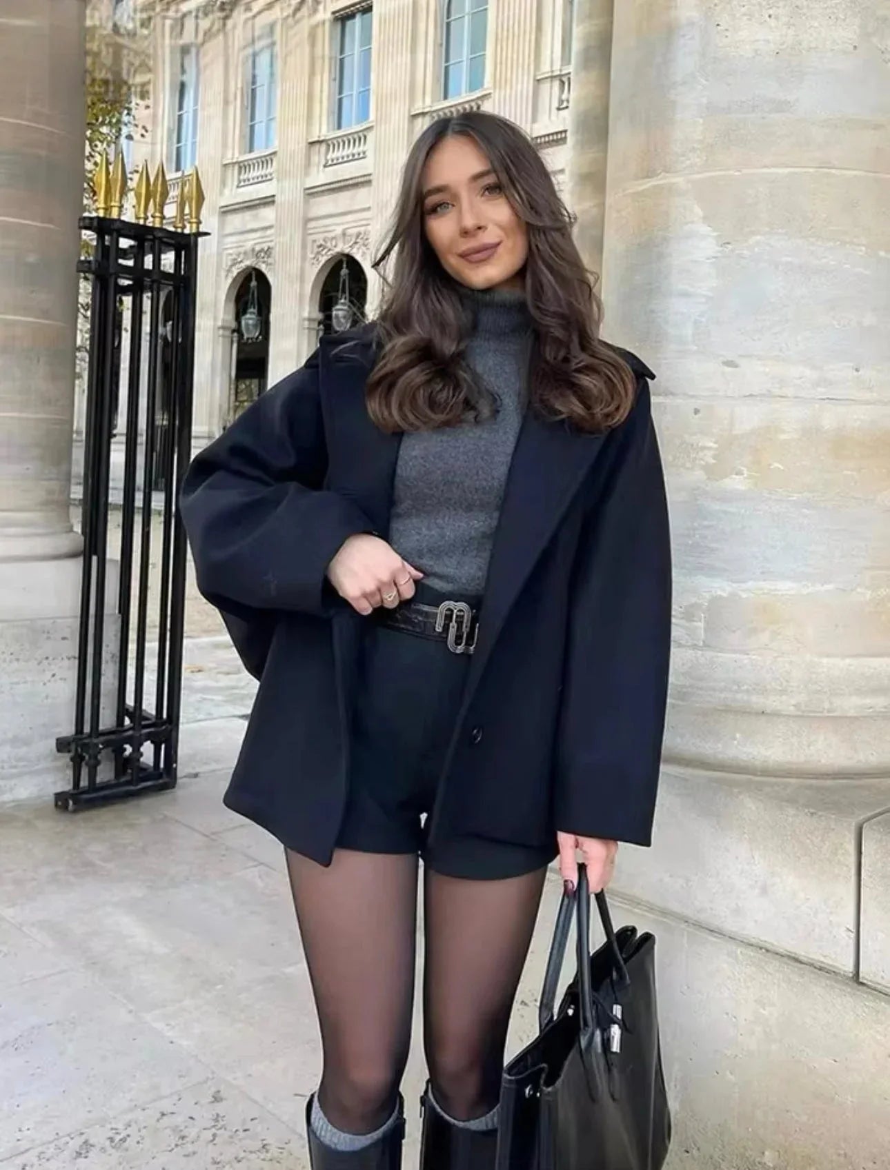 Women's loose-fit dark coat with large lapels and button front, long sleeves