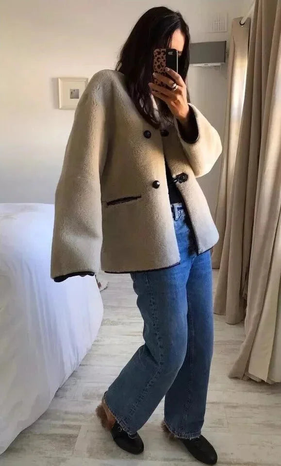 Light beige women's wool coat with front toggle closures, side pockets
