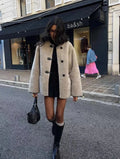 Light beige women's toggle coat with long sleeves and front panel fasteners