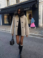 Light beige women's toggle coat with long sleeves and front panel fasteners
