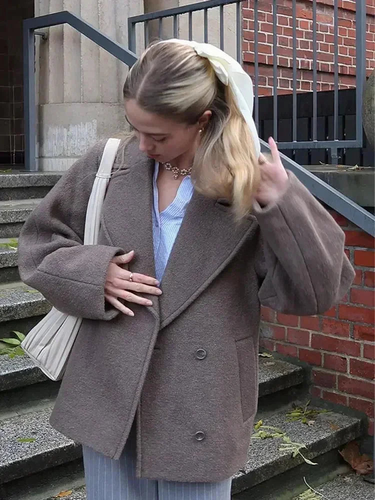 Women’s oversized brown coat with notched lapels and button front closure