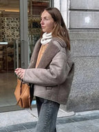 Women’s mauve teddy-collar coat with button closure and textured shearling lining