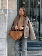 Women’s mauve teddy-collar coat with button front and relaxed fit shoulder seams