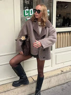 Women’s mauve teddy-collar coat with double-breasted buttons and short sleeves