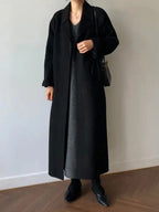 Long women's coat with belt and notched collar, black, wide lapels
