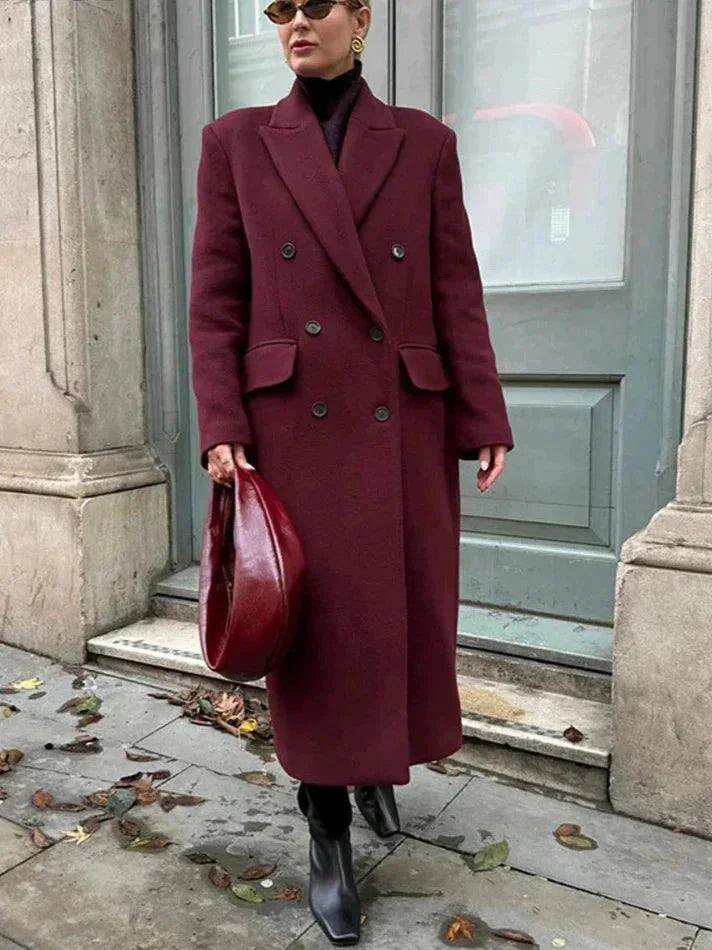 Burgundy long double-breasted coat with notched lapels and flap pockets