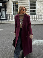 Burgundy long double-breasted coat with notched collar and double-button front