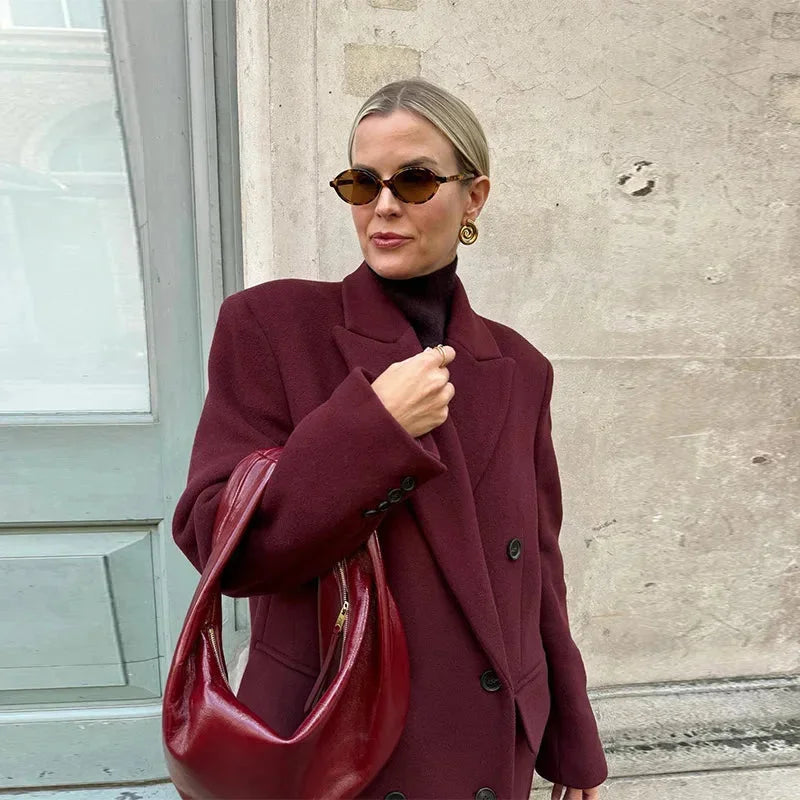 Burgundy long double-breasted coat with high notched collar and button closures