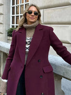 Burgundy double-breasted long coat with notched collar and flap pockets