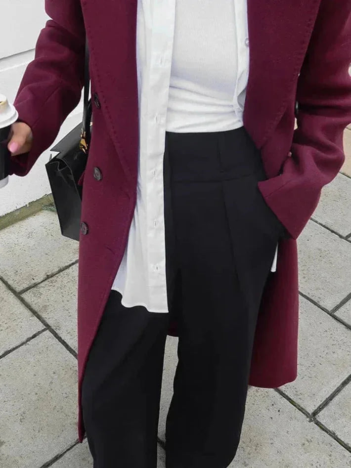 Burgundy long double-breasted coat with notched collar and button front