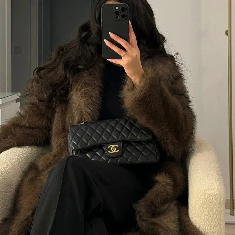 Women’s long faux fur coat in dark brown with fluffy shawl collar