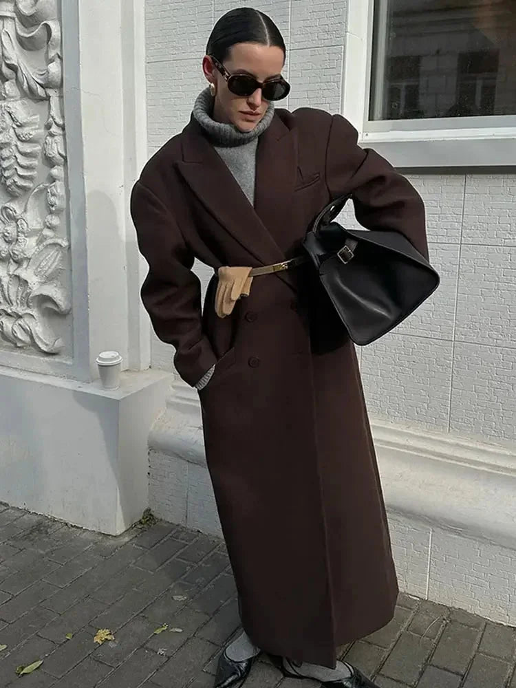 Long women's dark brown coat with notched lapels and voluminous sleeves