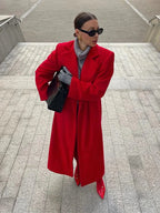 Long women's red coat with voluminous sleeves and notched lapels