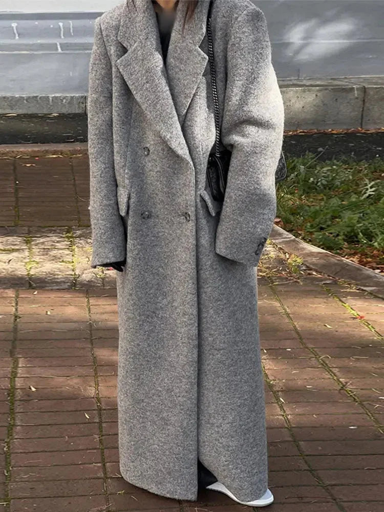Long dark gray wool-style coat with hood, vertical stripes, and buttoned front