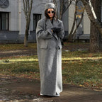 Long dark gray hooded coat with textured fabric, button front, and side pockets