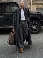 Long dark gray hooded coat with vertical stripes, open front, side pockets