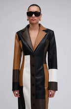 Long patchwork coat with notched lapels, black buttons, and brown/white color blocks.