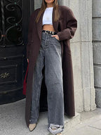 Women’s long burgundy coat with open front, lapels, and long sleeves