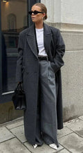 Women’s long dark gray coat with blazer-style lapels and front button closure