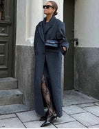 Women’s long coat, dark gray, notched lapels, front buttons, and two side pockets