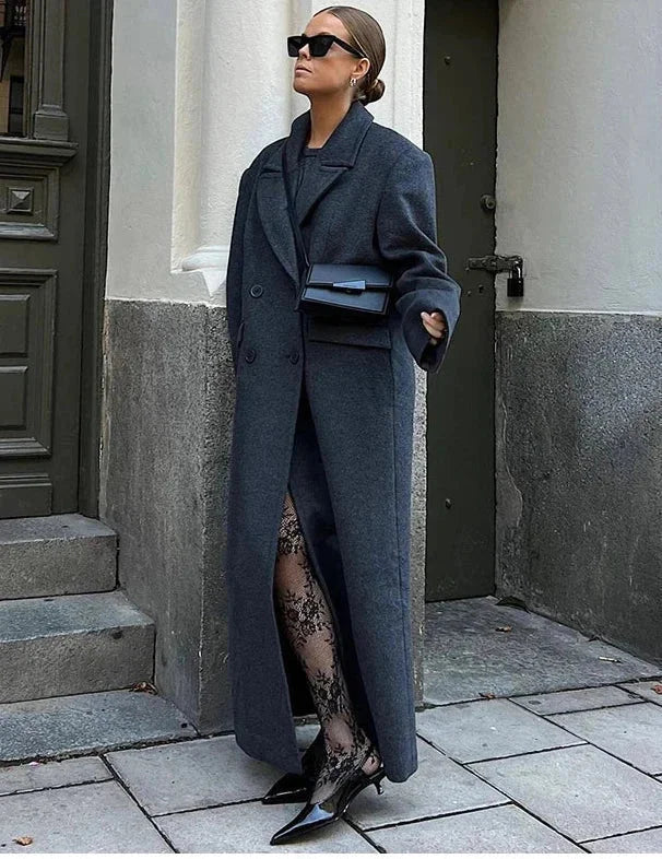 Women’s long coat, dark gray, notched lapels, front buttons, and two side pockets