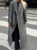 Women’s long gray speckled coat with long sleeves, open front, and draped hem