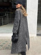 Women’s long gray textured coat with long sleeves and side slit opening