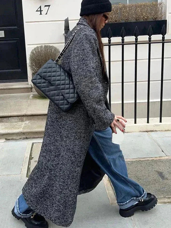 Women’s long gray speckled coat with long sleeves and deep front slit