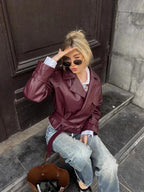 Burgundy short trench coat for women with belt, notched lapels and long sleeves