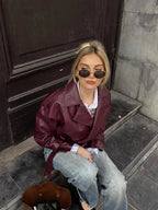 Burgundy belted short trench coat with notched lapels and long sleeves