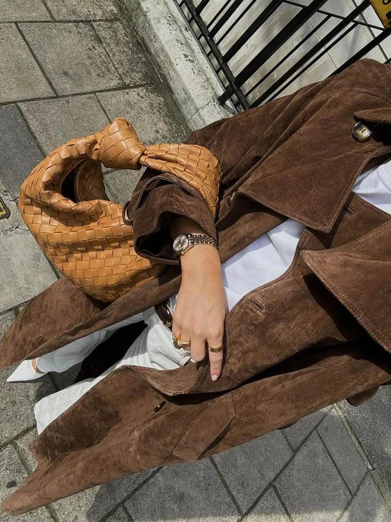 Brown womens trench coat with lapels and matching belt, front shown open