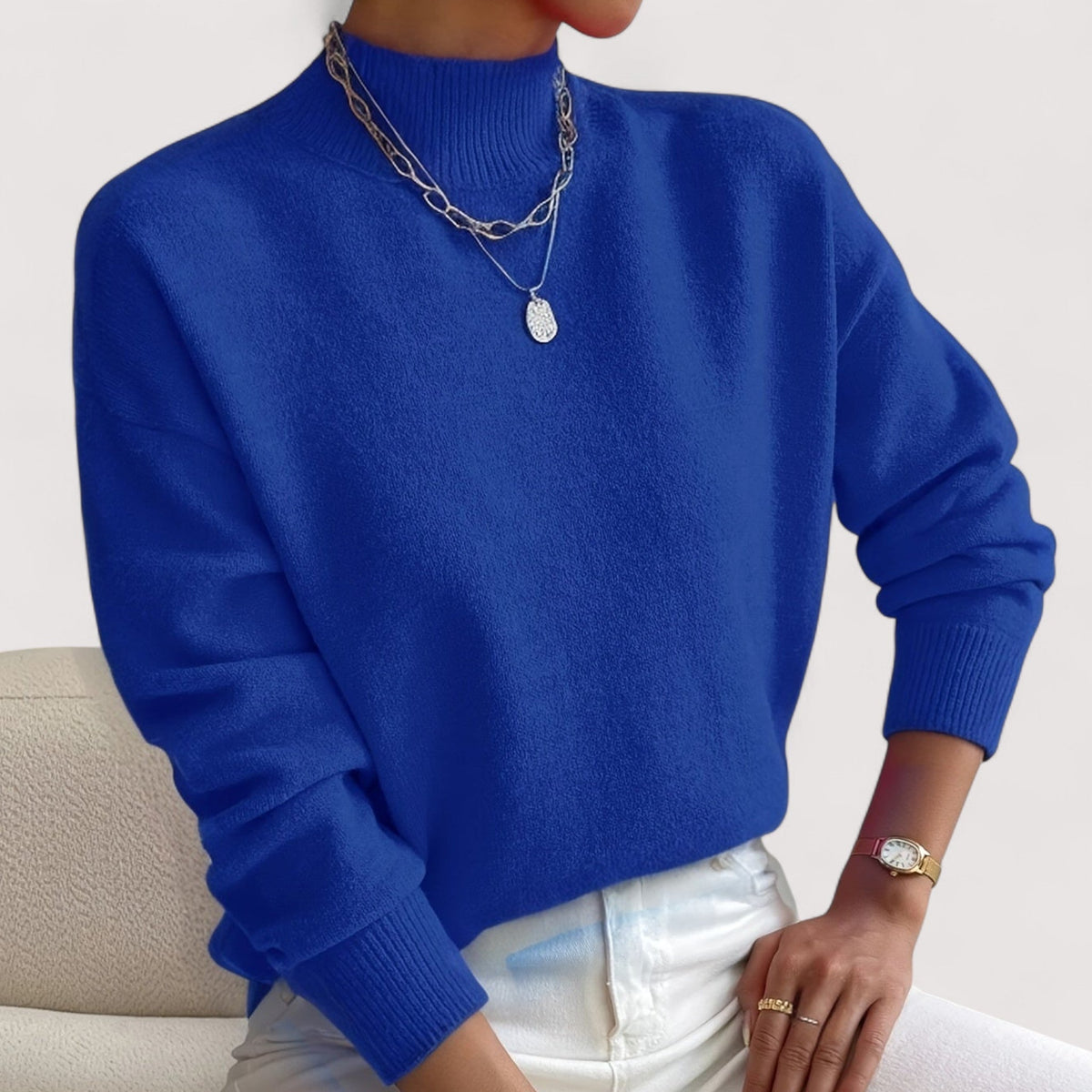 Blue women’s loose-fit sweater, crew neck, long sleeves, ribbed cuffs and hem.