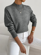 Dark gray women’s crew-neck sweater with ribbed cuffs and hem