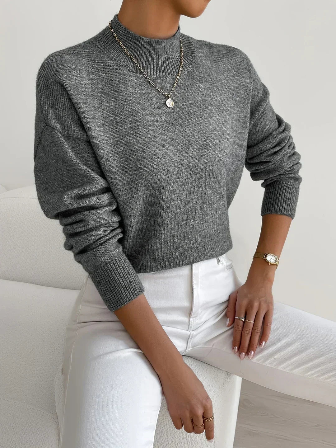 Dark gray women’s crew-neck sweater with ribbed cuffs and hem