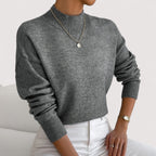 Dark gray women’s loose-fit sweater, crew neck, long sleeves, ribbed cuffs and hem.