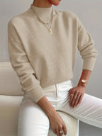 Beige women’s crew-neck sweater with ribbed cuffs and hem