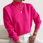 Pink women’s loose-fit sweater, crew neck, long sleeves, ribbed cuffs and hem.