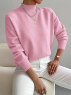 Light pink women’s crew-neck sweater with ribbed cuffs and hem