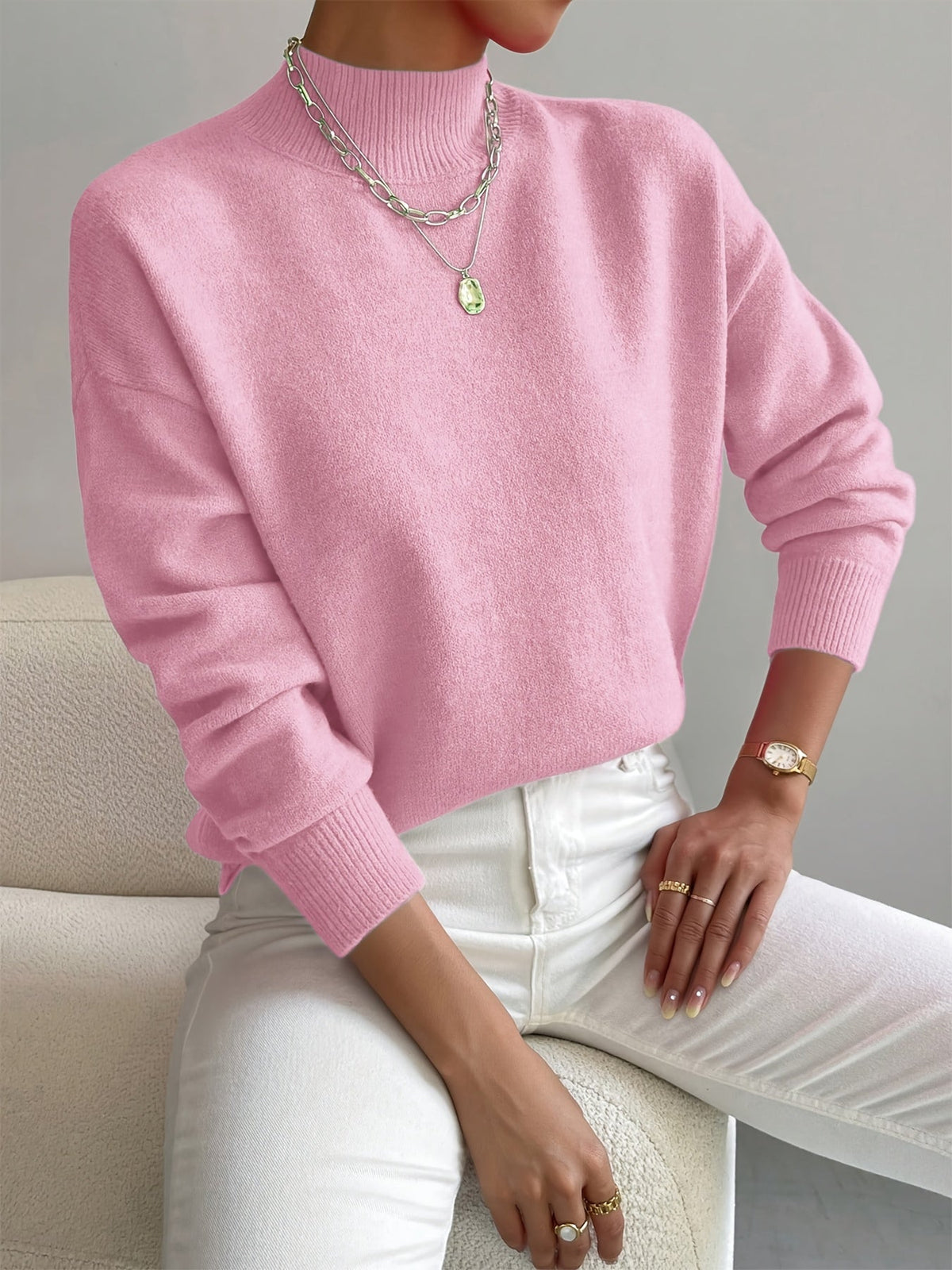 Light pink women’s crew-neck sweater with ribbed cuffs and hem