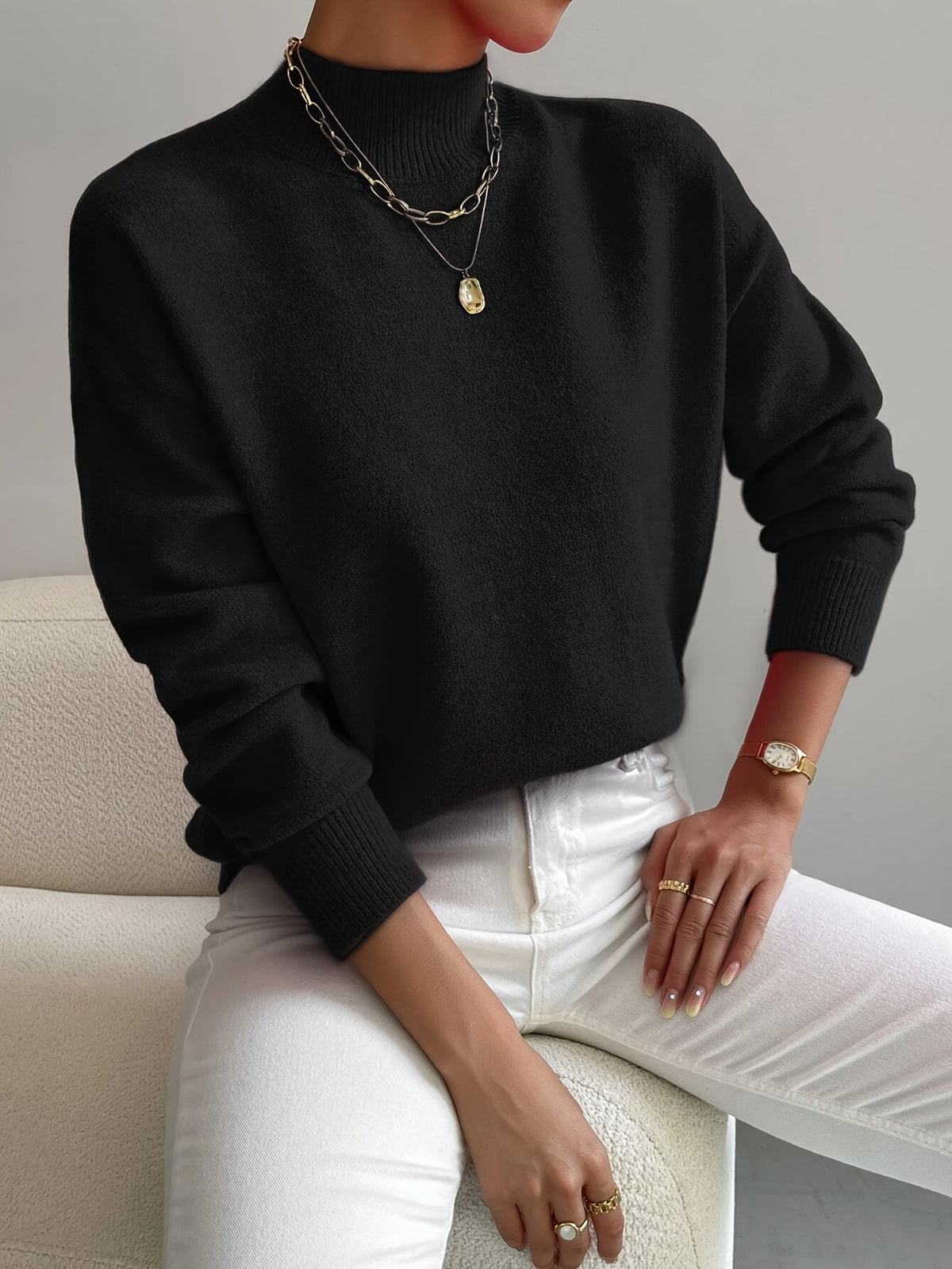 Black women’s crew-neck sweater with ribbed cuffs and hem