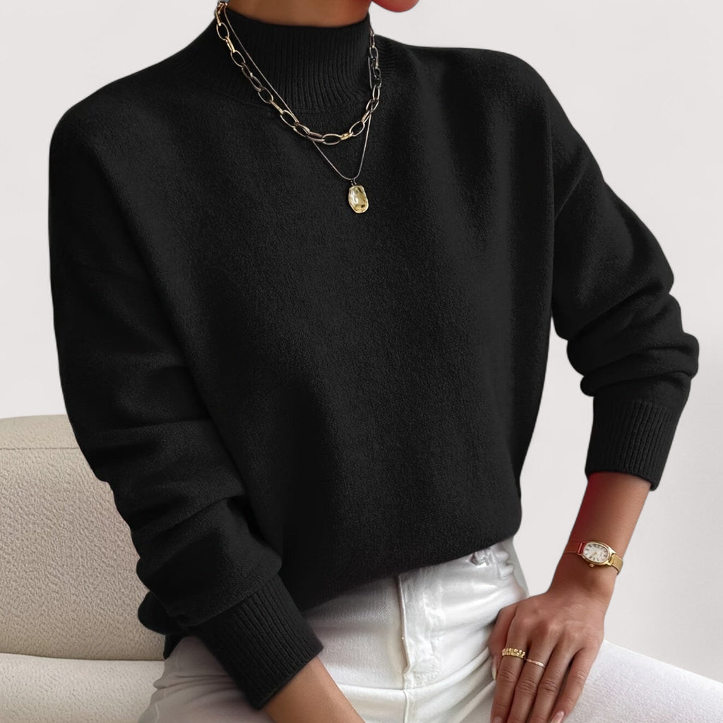 Black women’s loose-fit sweater, crew neck, long sleeves, ribbed cuffs and hem.