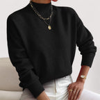 Black women’s loose-fit sweater, crew neck, long sleeves, ribbed cuffs and hem.