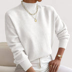White women’s loose-fit sweater, crew neck, long sleeves, ribbed cuffs and hem.