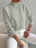 Light green women’s crew-neck sweater with ribbed cuffs and hem